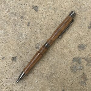 Zebra wood handmade pen is a medium brown twist pen with gun metal hardware