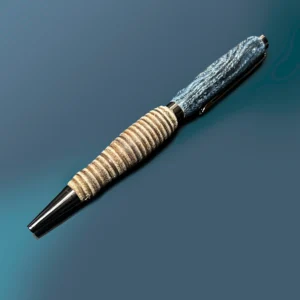 Leather & denim handmade pen features blue denim on the top half of the twist pen and thin rings of light-to-medium brown leather stacked across the bottom half of the pen with gun metal hardware.