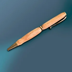 This soapstone handmade pen is peach in color with unique texture and antique brass hardware.
