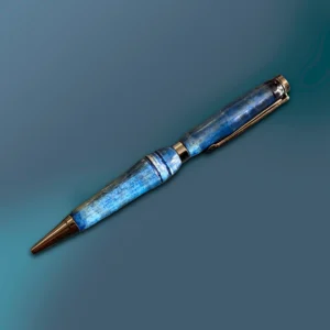 Maple wood handmade pen that has been dyed blue with vivid variations and gun metal hardware.